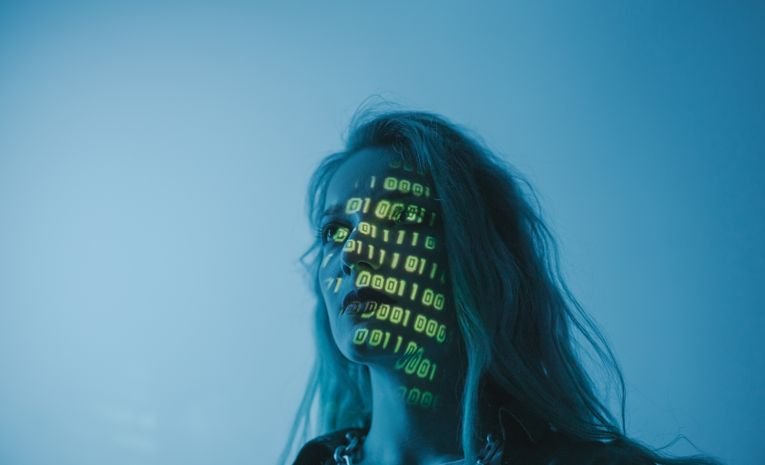 Small business owner reviewing a data protection policy document on a laptop, representing GDPR compliance for small businesses