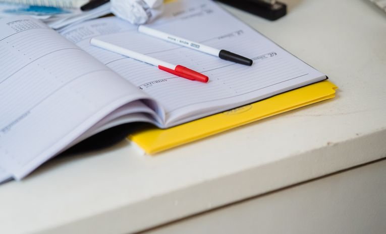 Open planner and to-do list on a desk, representing time management for entrepreneurs